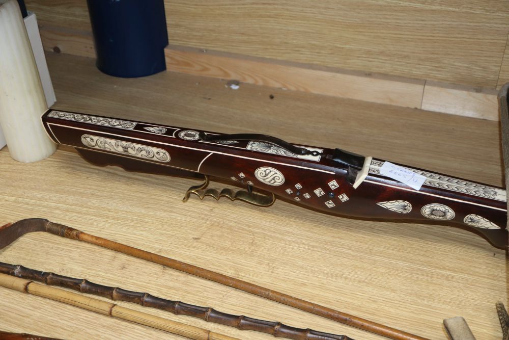 A European bone inlaid crossbow, two walking canes and three riding crops